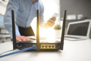 router man at home checking his router